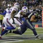 Seattle Seahawks tight end Jimmy Graham (88) makes a one-handed catch for a touchdown ahead of Buffalo Bills' Robert Blanton, left, and Nickell Robey-Coleman, center, in the first half of an NFL football game, Monday, Nov. 7, 2016, in Seattle. (AP Photo/Elaine Thompson)