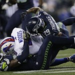 Seattle Seahawks' Earl Thomas (29) and Jeremy Lane (20) tackle Buffalo Bills wide receiver Robert Woods in the second half of an NFL football game, Monday, Nov. 7, 2016, in Seattle. (AP Photo/John Froschauer)