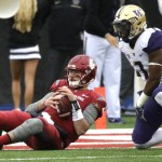 Washington State quarterback Luke Falk, left, gets up after being sacked by linebacker Keishawn Bierria, right, in the first half of an NCAA college football game, Friday, Nov. 25, 2016, in Pullman, Wash. (AP Photo/Ted S. Warren)