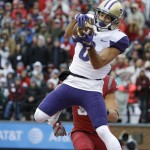 Washington wide receiver Dante Pettis makes a catch in front of Washington State linebacker Isaac Dotson for a touchdown in the first half of an NCAA college football game, Friday, Nov. 25, 2016, in Pullman, Wash. (AP Photo/Ted S. Warren)