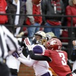 Washington wide receiver John Ross, left, eyes the pass he caught for a touchdown ahead of coverage from Washington State cornerback Darrien Molton (3) in the first half of an NCAA college football game, Friday, Nov. 25, 2016, in Pullman, Wash. (AP Photo/Ted S. Warren)