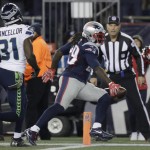 New England Patriots running back LeGarrette Blount (29) scores a touchdown in front of Seattle Seahawks safety Kam Chancellor (31) during the first second of an NFL football game, Sunday, Nov. 13, 2016, in Foxborough, Mass. (AP Photo/Charles Krupa)