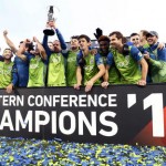 Seattle Sounders players celebrate with the trophy after defeating Colorado in the second leg of the MLS Western Conference soccer finals Sunday, Nov. 27, 2016, in Commerce City, Colo. (AP Photo/David Zalubowski)