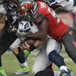 Tampa Bay Buccaneers defensive end Noah Spence (57) sacks Seattle Seahawks quarterback Russell Wilson (3) during the first quarter of an NFL football game Sunday, Nov. 27, 2016, in Tampa, Fla. (AP Photo/Jason Behnken)