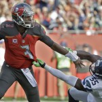 Tampa Bay Buccaneers quarterback Jameis Winston (3) pushes off Seattle Seahawks defensive end Frank Clark (55) during the first quarter of an NFL football game Sunday, Nov. 27, 2016, in Tampa, Fla. (AP Photo/Chris O'Meara)