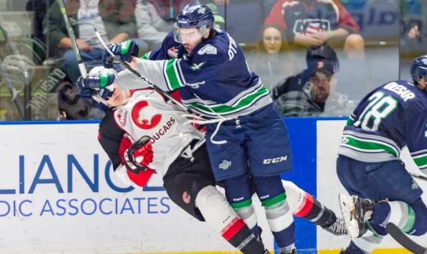 Seattle's Turner Ottenbreit delivers a big hit during the T-Birds 3-2 loss to Prince George (Brian ...