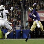Washington wide receiver John Ross (1) catches a pass next to Colorado defensive back Chidobe Awuzie (4), on the way to a touchdown during the second half of the Pac-12 Conference championship NCAA college football game Friday, Dec. 2, 2016, in Santa Clara, Calif. (AP Photo/Marcio Jose Sanchez)