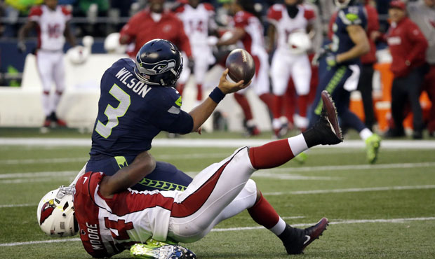 Russell Wilson was under constant pressure in the Seahawks' loss to Arizona on Saturday. (AP)...