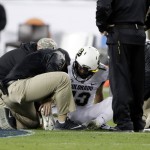 Colorado quarterback Sefo Liufau is attended on the field after an injury during the first half of the Pac-12 Conference championship NCAA college football game against Washington on Friday, Dec. 2, 2016, in Santa Clara, Calif. (AP Photo/Marcio Jose Sanchez)