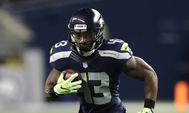 Troymaine Pope suffered a severe ankle sprain on his one carry for the Seahawks in Sunday's loss. (...