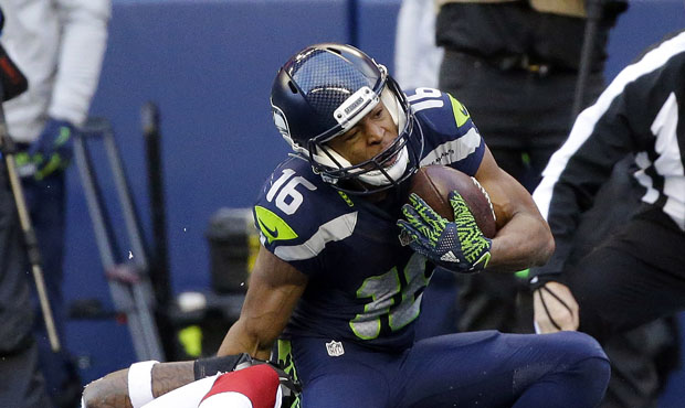 Tyler Lockett's foot and leg bent awkwardly on a long reception in the second quarter Saturday. (AP...