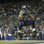 Seattle Seahawks running back Thomas Rawls celebrates after he rushed for a touchdown against the Detroit Lions in the second half of an NFL football NFC wild card playoff game, Saturday, Jan. 7, 2017, in Seattle. (AP Photo/Elaine Thompson)