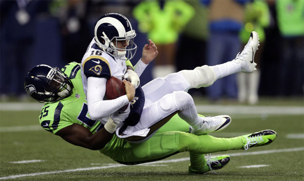 Frank Clark produced 10 sacks while counting less than $1 million against Seattle's salary cap. (AP...
