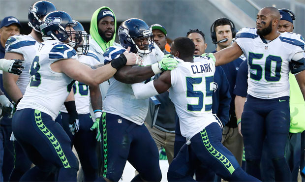 Frank Clark and Jarran Reed briefly went at it Sunday after Reed was ejected for allegedly throwing...