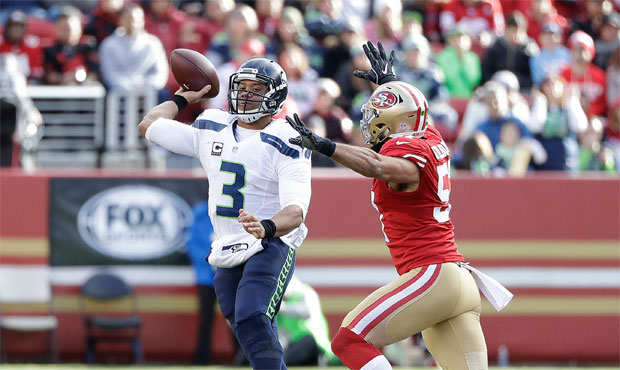 Russell Wilson has worn a brace on his left knee since spraining his MCL in Week 3. (AP)...