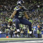 
              Seattle Seahawks running back Thomas Rawls celebrates after he rushed for a touchdown against the Detroit Lions in the second half of an NFL football NFC wild card playoff game, Saturday, Jan. 7, 2017, in Seattle. (AP Photo/Elaine Thompson)
            