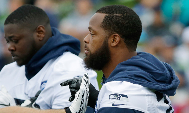 Michael Bennett said it was a call from Dan Quinn that brought him back to the Seahawks. (AP)...