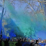 Members of the Emerald City Supporters hold up smoke effects as they take part in the traditional March to the Match before an MLS soccer match between the Seattle Sounders and the New York Red Bulls, Sunday, March 19, 2017, in Seattle. (AP Photo/Ted S. Warren)