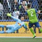 Seattle Sounders forward Clint Dempsey (2) scores a goal on a penalty kick against New York Red Bulls goalkeeper Luis Robles, left, during the first half of an MLS soccer match, Sunday, March 19, 2017, in Seattle. (AP Photo/Ted S. Warren)