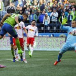 Seattle Sounders forward Jordan Morris, second from left, heads in a goal past New York Red Bulls goalkeeper Luis Robles, right, in the second half of an MLS soccer match, Sunday, March 19, 2017, in Seattle. The Sounders won 3-1. (AP Photo/Ted S. Warren)