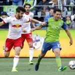 Seattle Sounders midfielder Nicolas Lodeiro, right, fends off New York Red Bulls midfielder Felipe during the second half of an MLS soccer match, Sunday, March 19, 2017, in Seattle. The Sounders won 3-1. (AP Photo/Ted S. Warren)