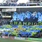 Seattle Sounders supporters display a tifo that reads "Champions" at the start of the Sounders home opener MLS soccer match against the New York Red Bulls, Sunday, March 19, 2017, in Seattle. (AP Photo/Ted S. Warren)
