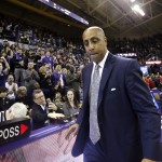 Washington head coach Lorenzo Romar turns away after taking the microphone off the scorers table to thank fans for coming to the game moments after the team lost to Arizona in an NCAA college basketball game Saturday, Feb. 18, 2017, in Seattle. Arizona won 76-68. (AP Photo/Elaine Thompson)