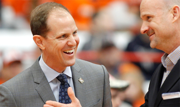 ESPN reports Mike Hopkins will sign a six-year deal to become the UW men's basketball coach. (AP)...