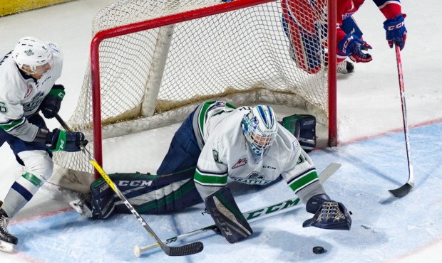 Rylan Toth dives for a loose puck during Seattle's 5-3 win against Spokane (Brian Liesse/T-Birds)...
