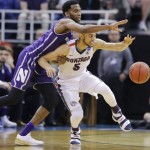 Northwestern forward Vic Law, left, defends against Gonzaga guard Nigel Williams-Goss (5) during the second half of a second-round college basketball game in the men's NCAA Tournament Saturday, March 18, 2017, in Salt Lake City. (AP Photo/Rick Bowmer)