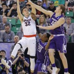 Northwestern's Gavin Skelly (44) and Scottie Lindsey (20) defend against Gonzaga forward Zach Collins (32) during the first half of a second-round college basketball game in the men's NCAA Tournament, Saturday, March 18, 2017, in Salt Lake City. (AP Photo/Rick Bowmer)