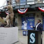 Seattle Mariners Hall of Famer Ken Griffey Jr. gestures toward a statue of him that was unveiled Thursday, April 13, 2017, in front of Safeco Field in Seattle. (AP Photo/Ted S. Warren)