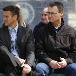Seattle Mariners general manager Jerry Dipoto, left, sits with manager Scott Servais, right, during the unveiling of a statue of former Mariner Ken Griffey Jr. on Thursday, April 13, 2017, in front of Safeco Field in Seattle. (AP Photo/Ted S. Warren)