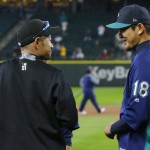 Miami Marlins' Ichiro Suzuki, left, talks with Seattle Mariners pitcher Hisashi Iwakuma, right, before batting practice prior to a baseball game against Ichiro's former team, the Seattle Mariners, Monday, April 17, 2017, in Seattle. (AP Photo/Ted S. Warren)