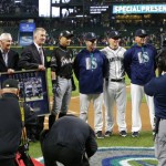 Miami Marlins' Ichiro Suzuki, fourth from left, is honored by Seattle Mariners players and executives for his 3,000 hit milestone in a pre-game ceremony before a baseball game against the Mariners, his former team, Monday, April 17, 2017, in Seattle. (AP Photo/Ted S. Warren)