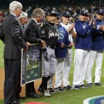 Miami Marlins' Ichiro Suzuki, fourth from left, is honored by Seattle Mariners players and executives for his 3,000 hit milestone in a pre-game ceremony before a baseball game against the Mariners, his former team, Monday, April 17, 2017, in Seattle. (AP Photo/Ted S. Warren)
