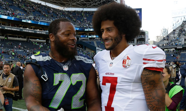 Michael Bennett thinks Colin Kaepernick would fit well in the Seahawks' locker room and in their of...