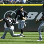 
              Chicago White Sox second baseman Yolmer Sanchez (5) sprints in between Avisail Garcia, center, and Tim Anderson, right, to catch a pop-up hit by Seattle Mariners' Daniel Vogelbach in the second inning of a baseball game, Sunday, May 21, 2017, in Seattle. (AP Photo/Ted S. Warren)
            