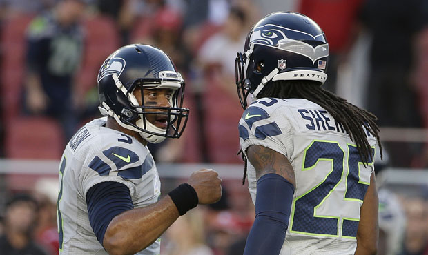 ESPN's recent story reveals differences between Russell Wilson and Richard Sherman. (AP)...