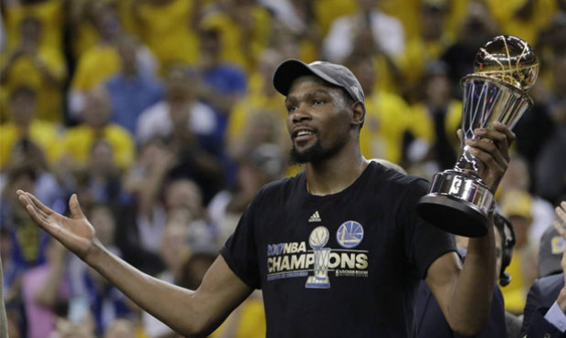 Kevin Durant capped his first season in Golden State with an NBA title and Finals MVP award. (AP)...