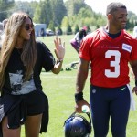 Seattle Seahawks quarterback Russell Wilson walks with his wife, pop singer Ciara, after NFL football training camp Monday, July 31, 2017, in Renton, Wash. (AP Photo/Ted S. Warren)