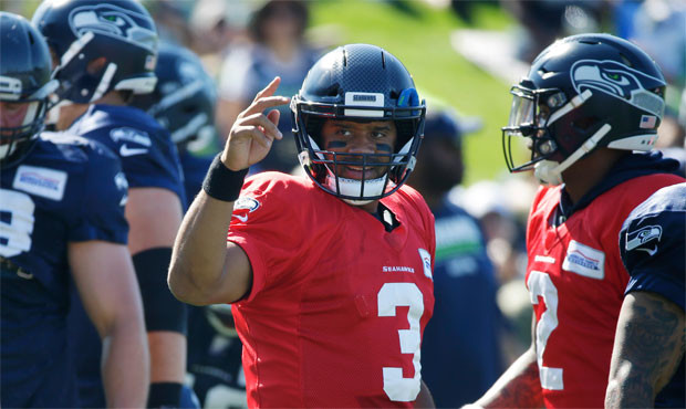 Russell Wilson said he feels faster after knee and ankle injuries limited his mobility last year. (...