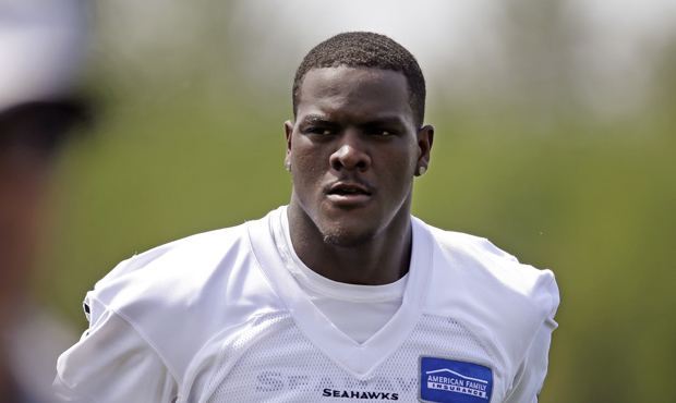 Frank Clark walks off the field after taking part in drills at Seattle Seahawks NFL football rookie...