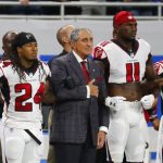 Atlanta Falcons owner Arthur Blank stands with his players during the national anthem before an NFL football game against the Detroit Lions, Sunday, Sept. 24, 2017, in Detroit. (AP Photo/Rick Osentoski)
