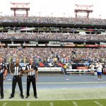 Officials stand on the sideline of the Seattle Seahawks during the playing of the national anthem before an NFL football game between the Seahawks and the Tennessee Titans Sunday, Sept. 24, 2017, in Nashville, Tenn. Neither team came out onto the field for the anthem. (AP Photo/Mark Zaleski)