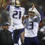 
              Washington wide receiver Quinten Pounds, left, celebrates his touchdown catch with quarterback Jake Browning during the second half against Colorado in an NCAA college football game Saturday, Sept. 23, 2017, in Boulder, Colo. Washington won 37-10. (AP Photo/David Zalubowski)
            