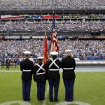 
              The American flag is presented in front of an empty Tennessee Titans bench area during the playing of the national anthem before an NFL football game between the Titans and the Seattle Seahawks Sunday, Sept. 24, 2017, in Nashville, Tenn. Neither team came onto the field for the anthem. (AP Photo/James Kenney)
            
