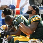 
              Green Bay Packers' Martellus Bennett, Lance Kendricks and Kevin King during the national anthem before an NFL football game against the Cincinnati Bengals Sunday, Sept. 24, 2017, in Green Bay, Wis. (AP Photo/Mike Roemer)
            