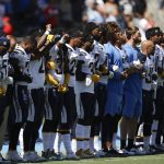 
              Members of the Los Angeles Chargers link arms during the national anthem before an NFL football game against the Kansas City Chiefs, Sunday, Sept. 24, 2017, in Carson, Calif. (AP Photo/Jae C. Hong)
            