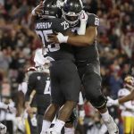 
              Washington State running back Jamal Morrow (25) celebrates his touchdown with offensive lineman Frederick Mauigoa (69) during the first half of an NCAA college football game against Southern California in Pullman, Wash., Friday, Sept. 29, 2017. (AP Photo/Young Kwak)
            